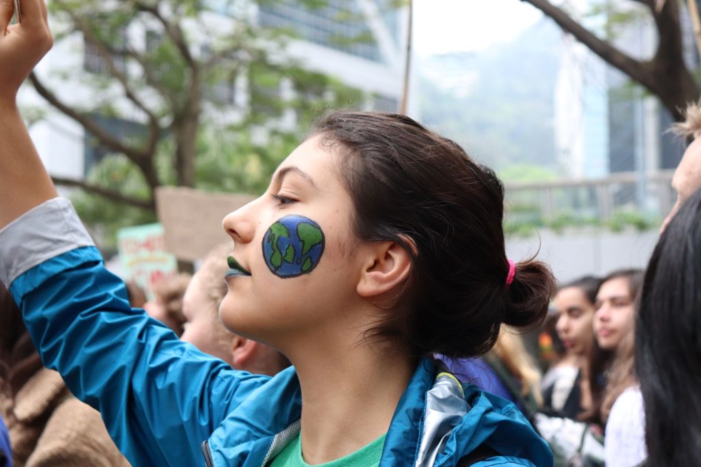 Student with a globe painted on her face.