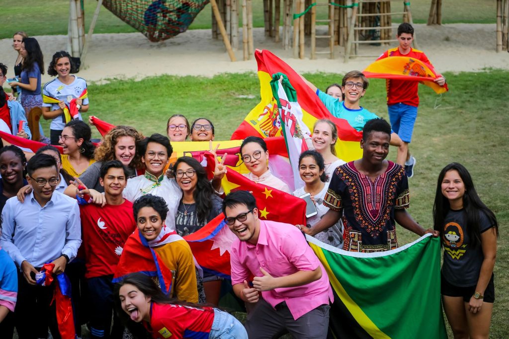 Students displaying national flags.